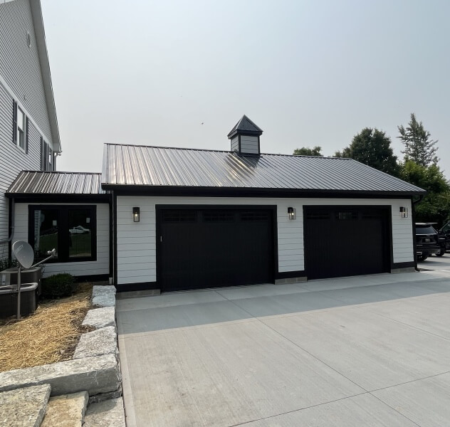 Newly built two car garage constructed by Ram Restoration.